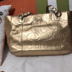 Gold coach bag